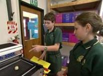 Students using the mould-making machine.