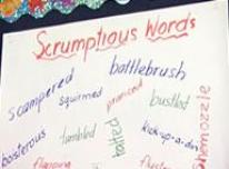 Whiteboard showing list of scrumptious words. 