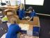 Students building a cardboard castle.